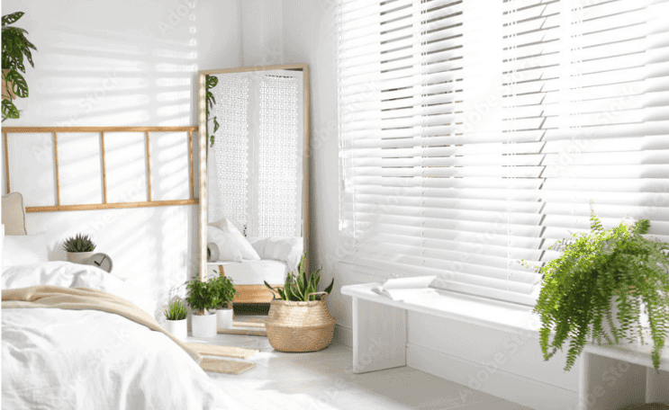Bedroom with aluminum venetian blinds